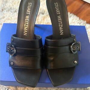 Stuart Weitzman Black Leather Mules with Buckle Detail